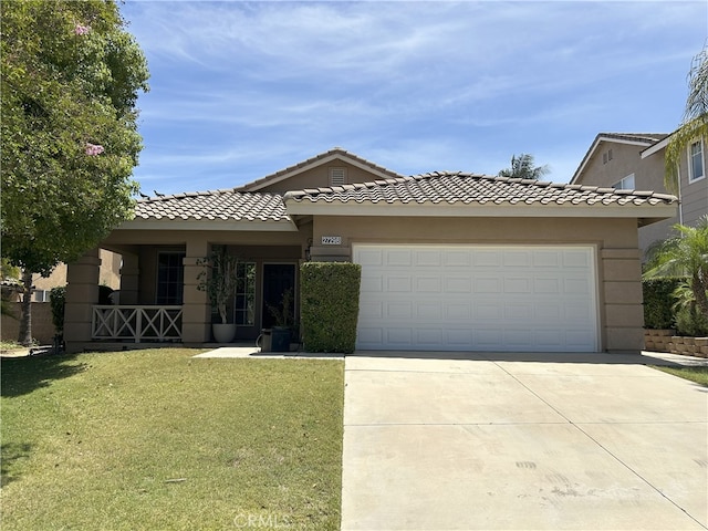 27298 Buffalo Trl, Corona, CA 92883 - view of front of home with driveway, a front yard, a garage, stucco siding, and a tile roof