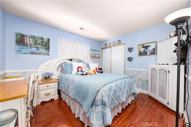 37028 Velutina Way, Palmdale, CA 93550 - bedroom featuring wood finished floors, wainscoting, and a closet