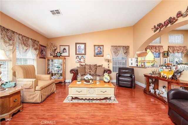 37028 Velutina Way, Palmdale, CA 93550 - living area with lofted ceiling, wood finished floors, and arched walkways
