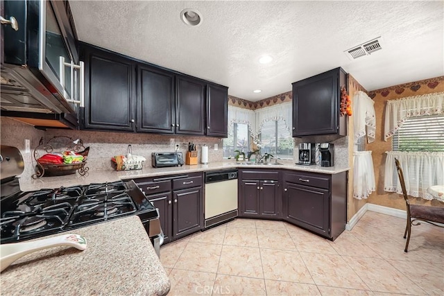 37028 Velutina Way, Palmdale, CA 93550 - kitchen with dishwasher, gas range oven, a textured ceiling, and light countertops