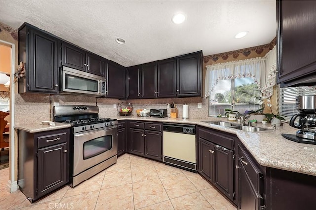37028 Velutina Way, Palmdale, CA 93550 - kitchen featuring stainless steel appliances, tasteful backsplash, a textured ceiling, recessed lighting, and light tile patterned flooring