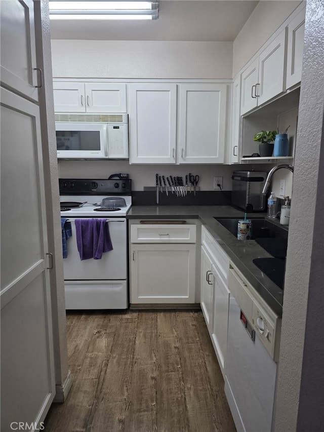 10655 Lemon Ave Unit 1508, Rancho Cucamonga, CA 91737 - kitchen with white appliances, white cabinetry, dark wood-style floors, and dark countertops