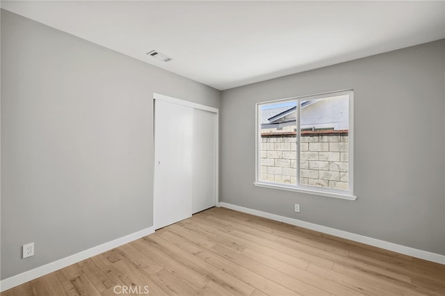 6903 Crest Ave, Riverside, CA 92503 - unfurnished bedroom featuring light wood-style floors and a closet