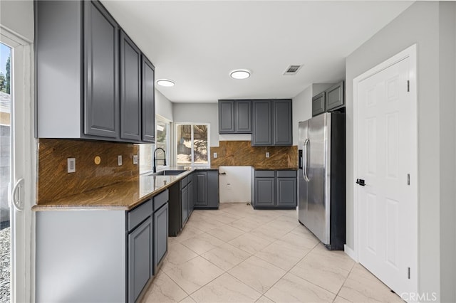 6903 Crest Ave, Riverside, CA 92503 - kitchen featuring stainless steel refrigerator with ice dispenser, healthy amount of natural light, and gray cabinets
