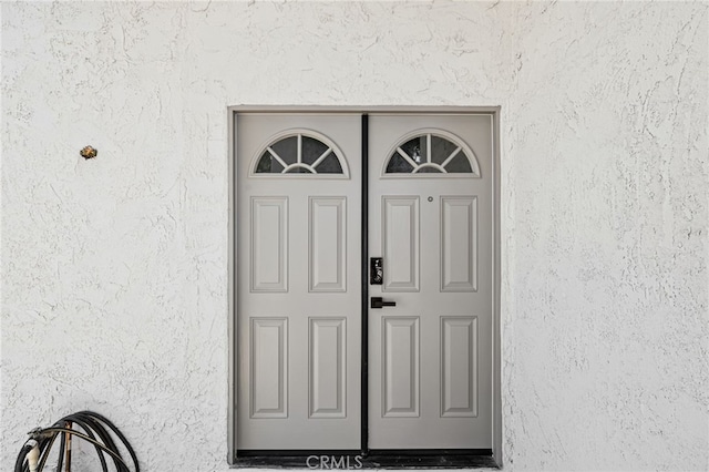 6903 Crest Ave, Riverside, CA 92503 - doorway to property with stucco siding