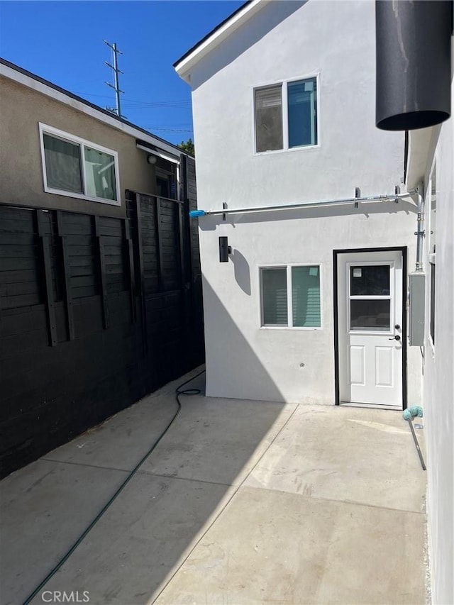 3028 E 1st St, Los Angeles, CA 90063 - back of property with stucco siding and a patio area