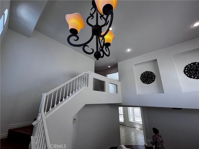 16340 Willowmist Ct, Chino Hills, CA 91709 - staircase with recessed lighting, tile patterned floors, a chandelier, and a towering ceiling