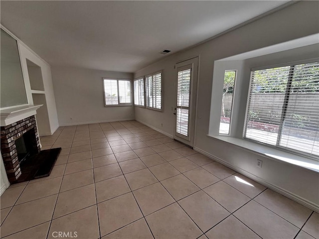 16340 Willowmist Ct, Chino Hills, CA 91709 - unfurnished living room featuring light tile patterned flooring and a brick fireplace