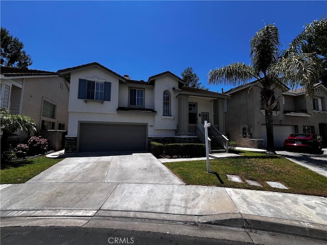 16340 Willowmist Ct, Chino Hills, CA 91709 - view of front of house with concrete driveway, stucco siding, a garage, and stone siding