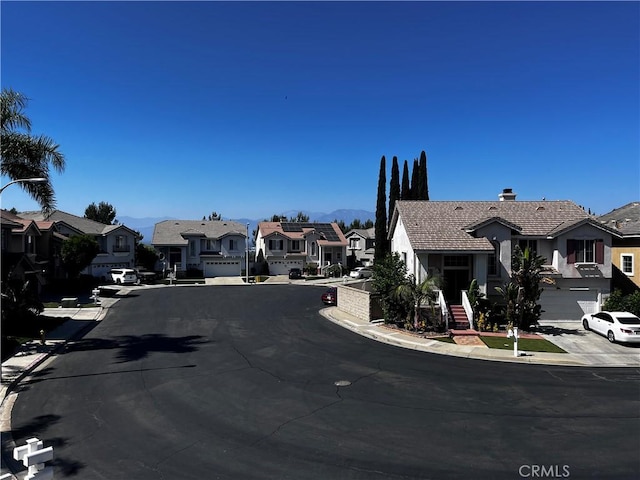 16340 Willowmist Ct, Chino Hills, CA 91709 - view of asphalt road featuring a residential view, curbs, and sidewalks