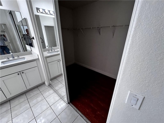 16340 Willowmist Ct, Chino Hills, CA 91709 - bathroom with two vanities, tile patterned floors, and a spacious closet