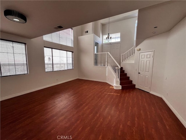 16340 Willowmist Ct, Chino Hills, CA 91709 - unfurnished living room featuring wood finished floors, stairs, a chandelier, and a high ceiling