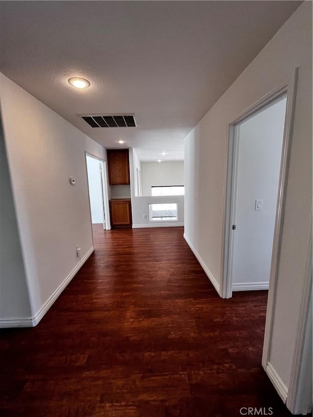 16340 Willowmist Ct, Chino Hills, CA 91709 - hallway featuring dark wood-style flooring and baseboards