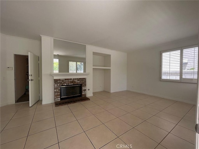 16340 Willowmist Ct, Chino Hills, CA 91709 - unfurnished living room featuring built in shelves, light tile patterned floors, and a brick fireplace