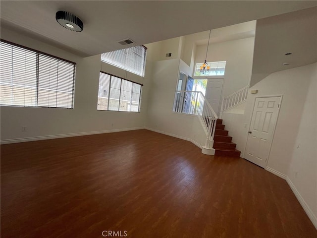 16340 Willowmist Ct, Chino Hills, CA 91709 - unfurnished living room featuring a chandelier, wood finished floors, plenty of natural light, and stairway