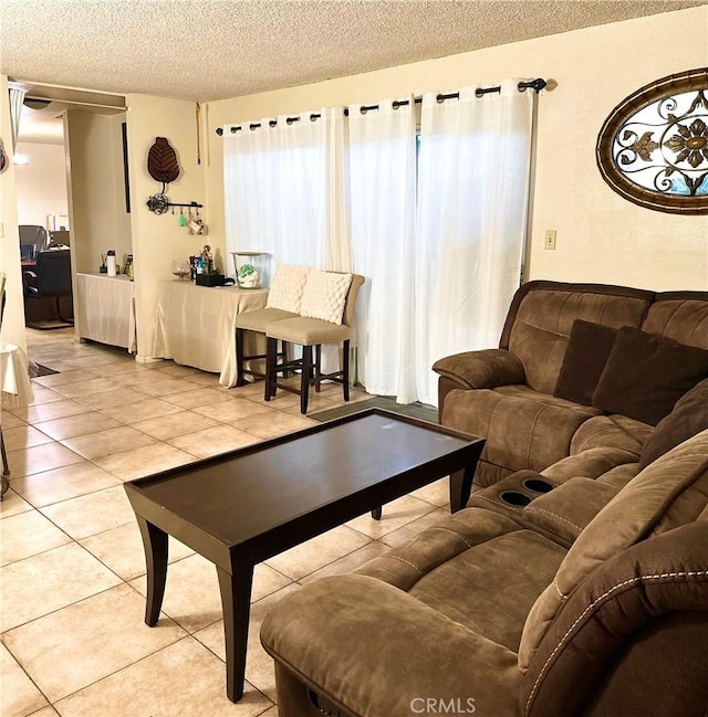 9620 San Vincente Ave, South Gate, CA 90280 - living room with a textured ceiling and tile patterned floors