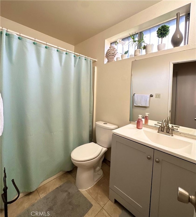 9620 San Vincente Ave, South Gate, CA 90280 - full bath featuring vanity, tile patterned flooring, and a shower with shower curtain