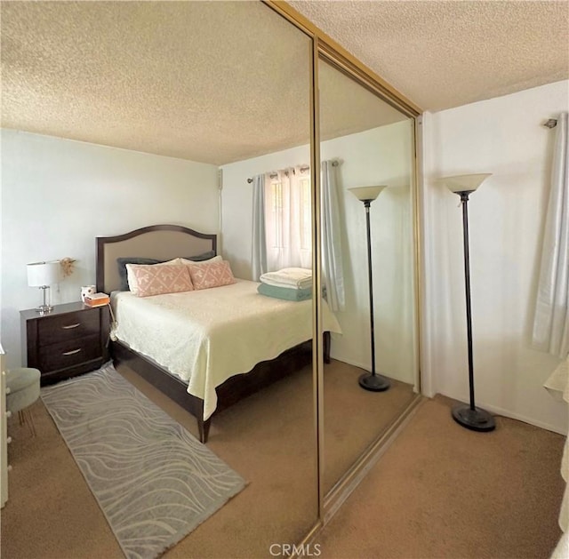 9620 San Vincente Ave, South Gate, CA 90280 - carpeted bedroom with a textured ceiling and a closet