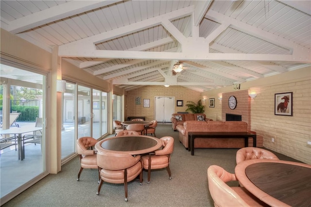 662 Via Zapata, Riverside, CA 92507 - dining area with brick wall, light carpet, and a ceiling fan