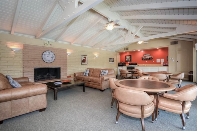 662 Via Zapata, Riverside, CA 92507 - living room with light colored carpet, a brick fireplace, a ceiling fan, and brick wall