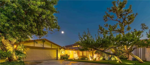 662 Via Zapata, Riverside, CA 92507 - view of front of home featuring concrete driveway, an attached garage, and stucco siding