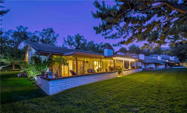662 Via Zapata, Riverside, CA 92507 - rear view of property with a yard, a chimney, and a porch