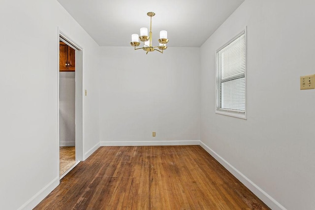 14202 Del Amo Ave, Tustin, CA 92780 - spare room with a chandelier and wood finished floors