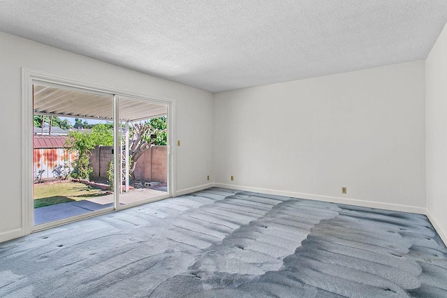 14202 Del Amo Ave, Tustin, CA 92780 - spare room featuring carpet and a textured ceiling