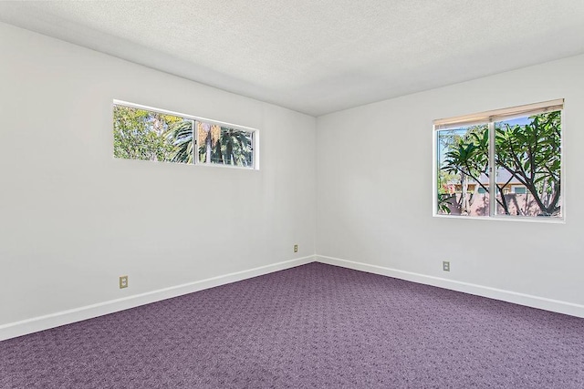 14202 Del Amo Ave, Tustin, CA 92780 - spare room with dark colored carpet and a textured ceiling