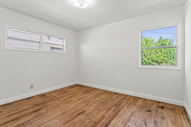 14202 Del Amo Ave, Tustin, CA 92780 - unfurnished room featuring healthy amount of natural light and wood-type flooring