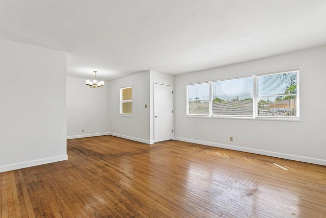 14202 Del Amo Ave, Tustin, CA 92780 - spare room featuring a chandelier and hardwood / wood-style floors