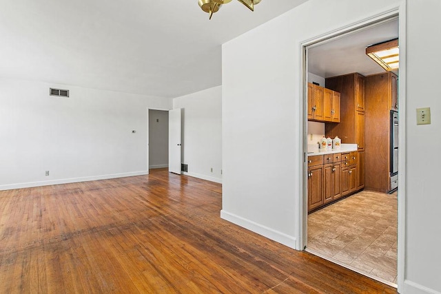 14202 Del Amo Ave, Tustin, CA 92780 - unfurnished room featuring wood finished floors