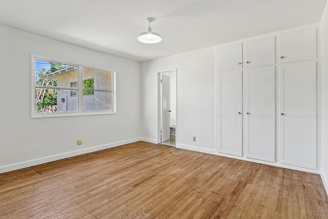 14202 Del Amo Ave, Tustin, CA 92780 - unfurnished bedroom with light wood finished floors, a closet, and connected bathroom