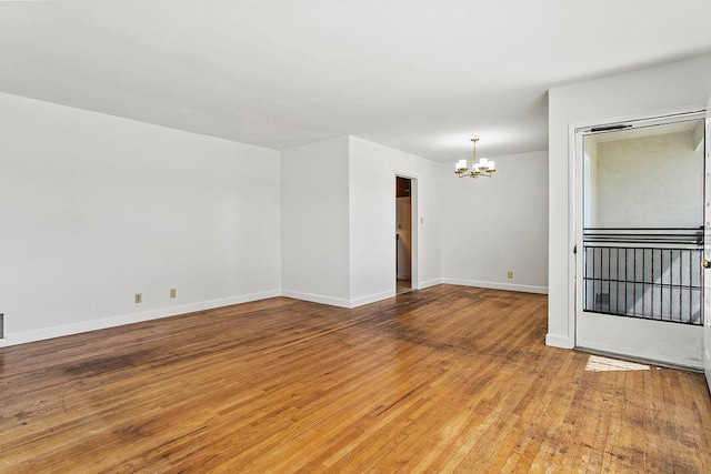 14202 Del Amo Ave, Tustin, CA 92780 - empty room featuring a chandelier and hardwood / wood-style flooring