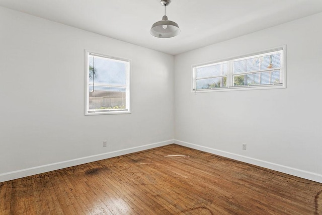 14202 Del Amo Ave, Tustin, CA 92780 - unfurnished room with baseboards and hardwood / wood-style flooring