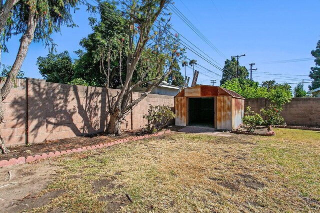 14202 Del Amo Ave, Tustin, CA 92780 - fenced backyard featuring a storage unit