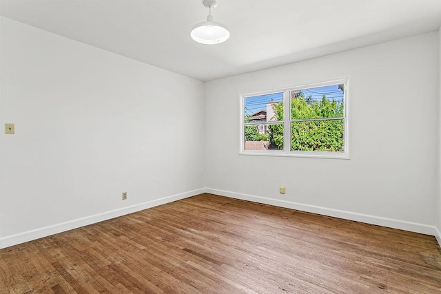 14202 Del Amo Ave, Tustin, CA 92780 - empty room with wood finished floors and baseboards