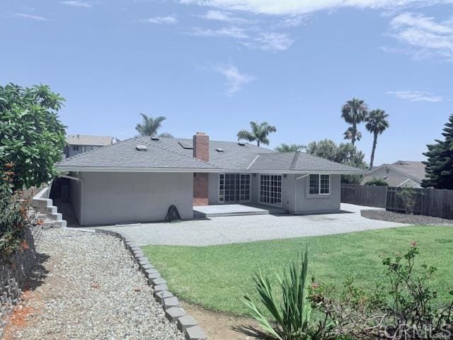 2015 Elevada St, Oceanside, CA 92054 - rear view of house featuring a patio, stucco siding, and a chimney