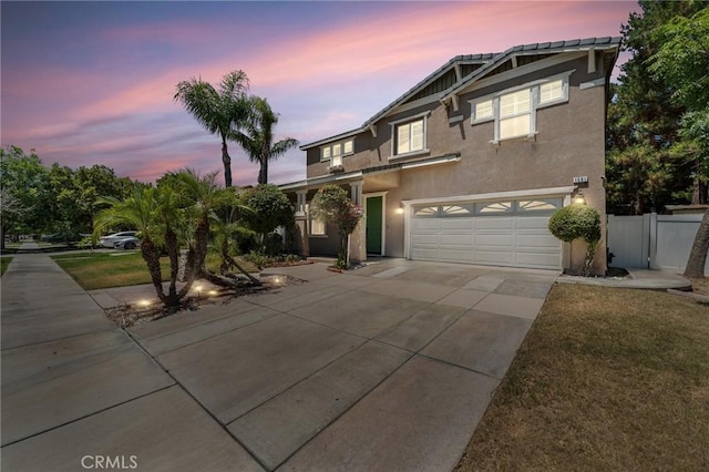 1581 Margit St, Redlands, CA 92374 - view of front of house featuring driveway, an attached garage, and stucco siding