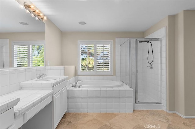 1581 Margit St, Redlands, CA 92374 - bathroom with vanity, healthy amount of natural light, a garden tub, and a shower stall