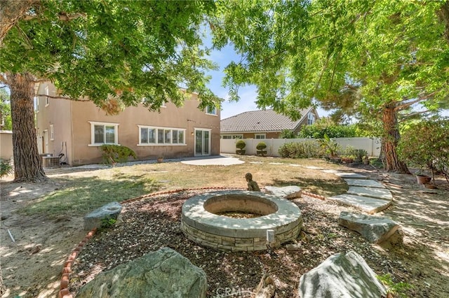 1581 Margit St, Redlands, CA 92374 - fenced backyard with an outdoor fire pit and a patio