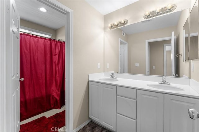 1581 Margit St, Redlands, CA 92374 - bathroom featuring double vanity and a shower with shower curtain