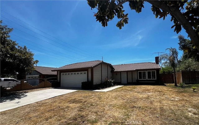 4214 Harrison St, Riverside, CA 92503 - ranch-style house with a tile roof, a garage, concrete driveway, and a chimney