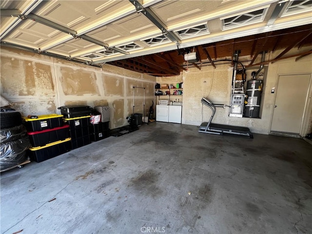 4214 Harrison St, Riverside, CA 92503 - garage with washer and clothes dryer, secured water heater, and a garage door opener