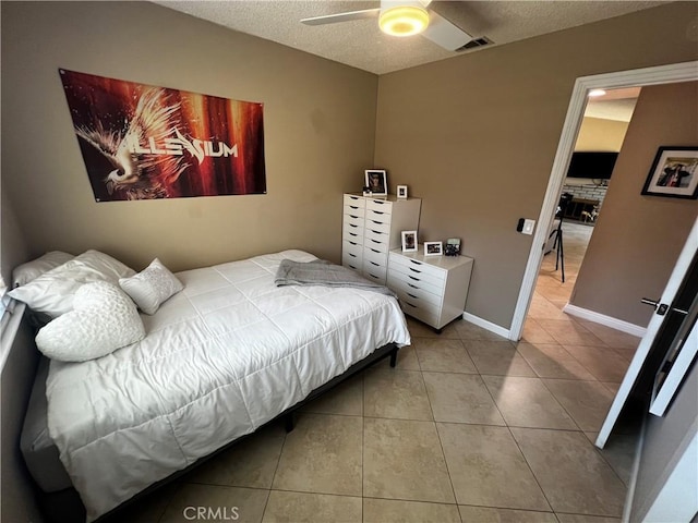 4214 Harrison St, Riverside, CA 92503 - bedroom featuring tile patterned flooring, a textured ceiling, and ceiling fan