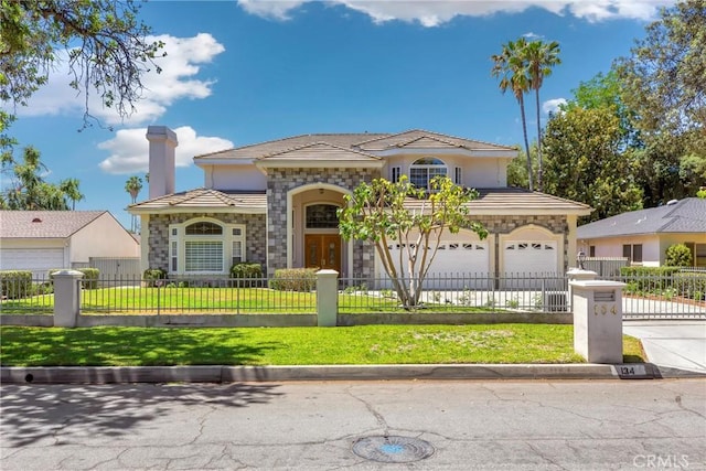 134 E Las Flores Ave, Arcadia, CA 91006 - mediterranean / spanish-style home with concrete driveway, a fenced front yard, a tile roof, stone siding, and stucco siding