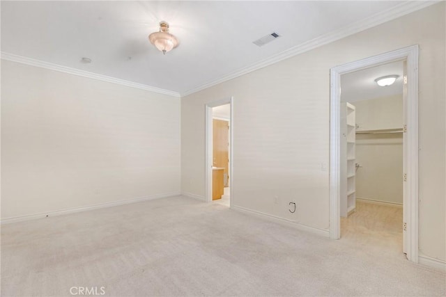 134 E Las Flores Ave, Arcadia, CA 91006 - unfurnished bedroom featuring crown molding, a spacious closet, and carpet