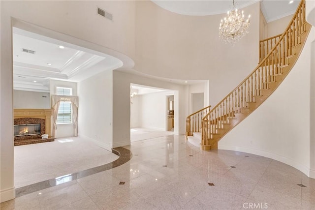 134 E Las Flores Ave, Arcadia, CA 91006 - entrance foyer featuring granite tiled floors, stairway, crown molding, recessed lighting, and a chandelier