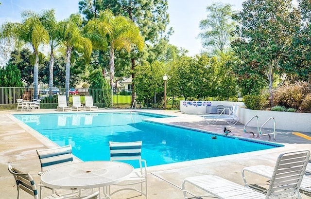 2007 W W Wind, Santa Ana, CA 92704 - community pool featuring a patio area and view of scattered trees