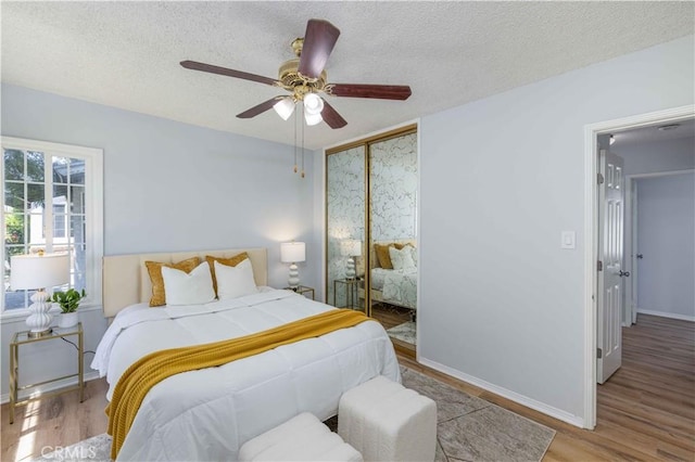 12108 Dunrobin Ave, Downey, CA 90242 - bedroom with wood finished floors, a closet, a textured ceiling, and ceiling fan